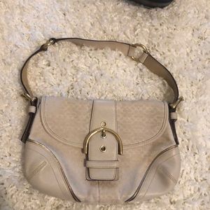 White and gold coach bag
